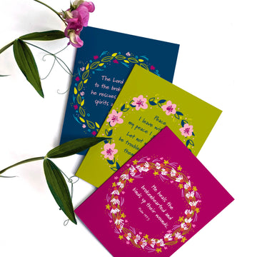 Fan of 3 Christian sympathy cards featuring floral wreaths around the Scripture. 