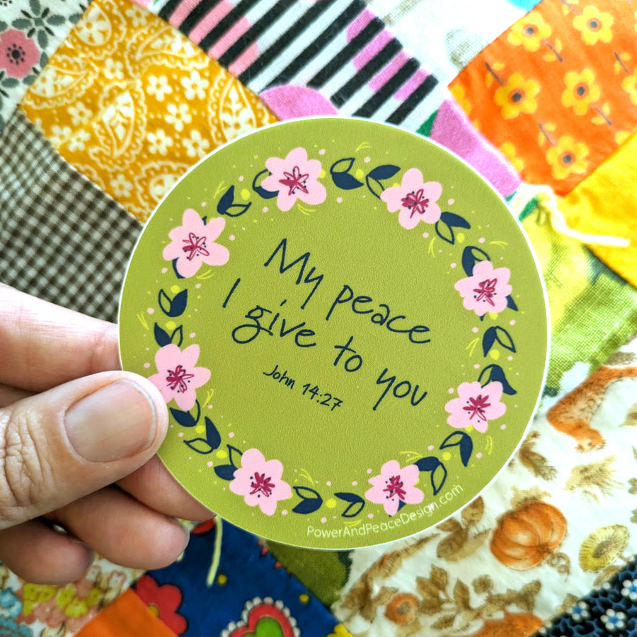 Scripture sticker with flower and Bible verse quote from John 14:27.
