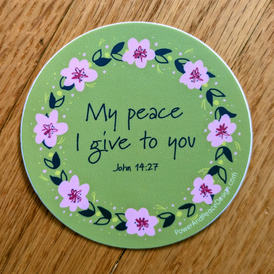 Lime green Christian vinyl sticker with flower border and Jesus quote from John 14:27: My pace I give to you.