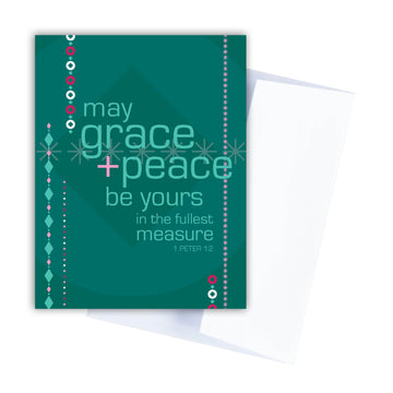 Dark green Scripture Christmas card with ornament and beaded garland. Modern Christmas card features text from 1 Peter 1:2 May grace and peace be yours in the fullest measure.