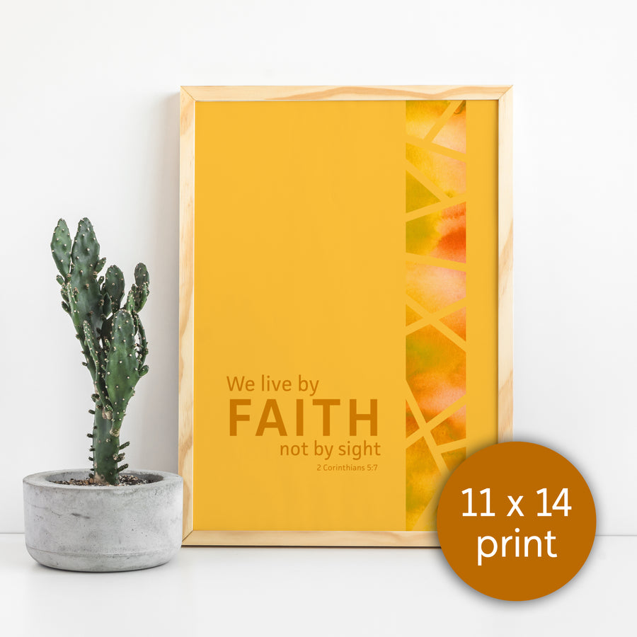 Mustard yellow Scripture art print framed in light wood with cactus to the side. Text reads We live by faith not by sight. 2 Corinthians 5:7. Circle in corner labels image as 11x14 print.