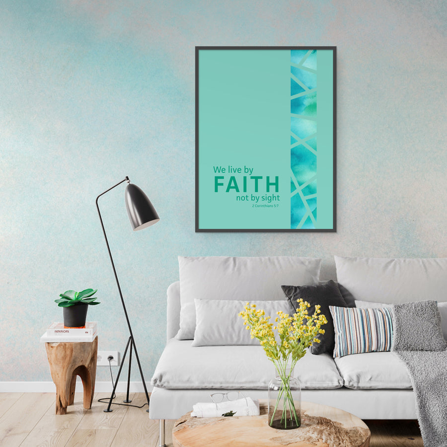 Living room scene with beige couch, wood floor, wood tables, and black lamp. Framed art on wall in seafoam green with Bible verse. We live by faith not by sight. 2 Corinthians 5:7.