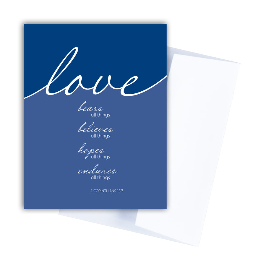 Blue Bible verse greeting card. Love bears all things, believes all things, hopes all things, endures all things. 1 Corinthians 13:7. Notecard shown with white envelope.