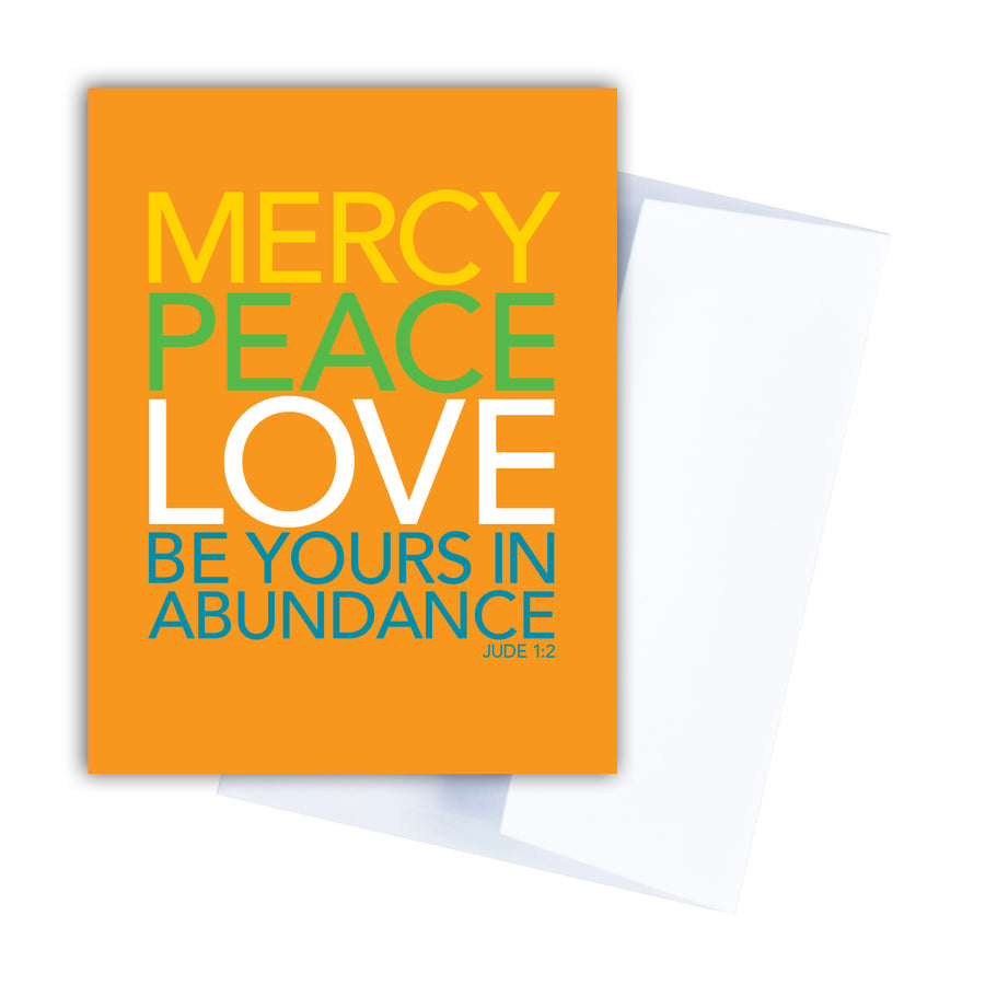 Orange Bible verse greeting card and white envelope. Text is in yellow, green, white, and teal and reads Mercy, peace, love be yours in abundance. Jude 1:2.