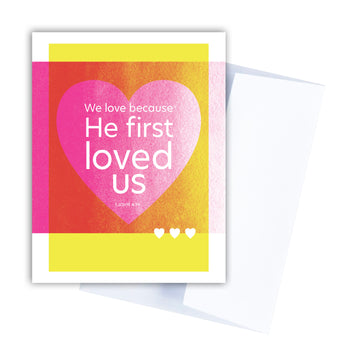 Colorful Christian Valentine card with 1 John 4:19 We love because He first loved us.