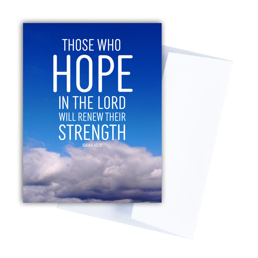 Blue Christian greeting card. Front of card features a blue sky with fluffy white clouds along the bottom. White text reads Those who hope in the Lord will renew their strength. Isaiah 40:31. Notecard shown with white envelope.