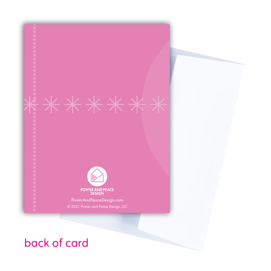 Back of pink Christmas card overlapping with white envelope.