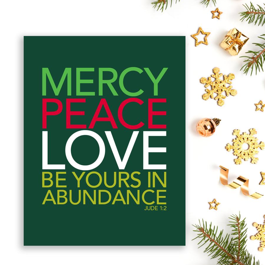 Jude 1:2 Christmas card with bold Christian typography reading Mercy, Peace, Love be yours in abundance.