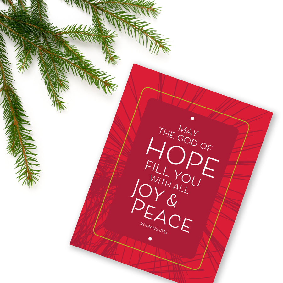 Red Scripture Christmas card with blessing from Romans 15:13 May the God of hope fill you with all joy & peace