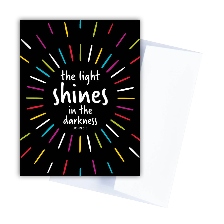 John 1:5 Christian greeting card with the words the light shines in the darkness.