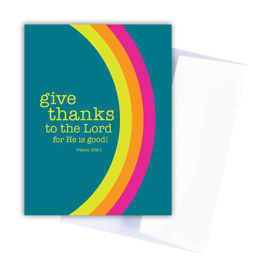 Colorful Christian greeting card with Psalm 106:1 Give thanks to the Lord for He is good! Card is teal with a rainbow of yellow, orange, and pink. White envelope at an angle behind the card.