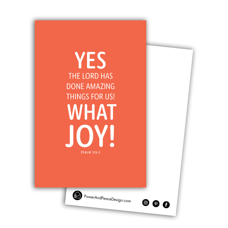 Christian postcard with coral background and white text reading Yes, the Lord has done amazing things for us! What joy! Psalm 126:3. Back of postcard is white with black Power and Peace Design logo.