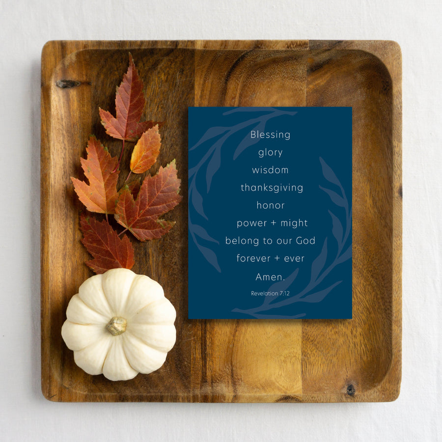 Blue Christian Thanksgiving card on wood tray with autumn leaves and pumpkin.