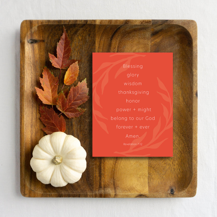 Wood tray with autumn leaves, white gourd, and orange Thanksgiving card with Scripture.