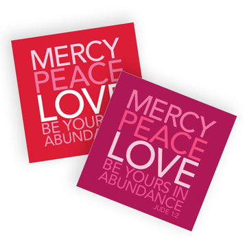 Two Christian valentine cards reading Mercy, peace, love be yours in abundance. Jude 1:2. One is read and pink and the other is in shades of pink.