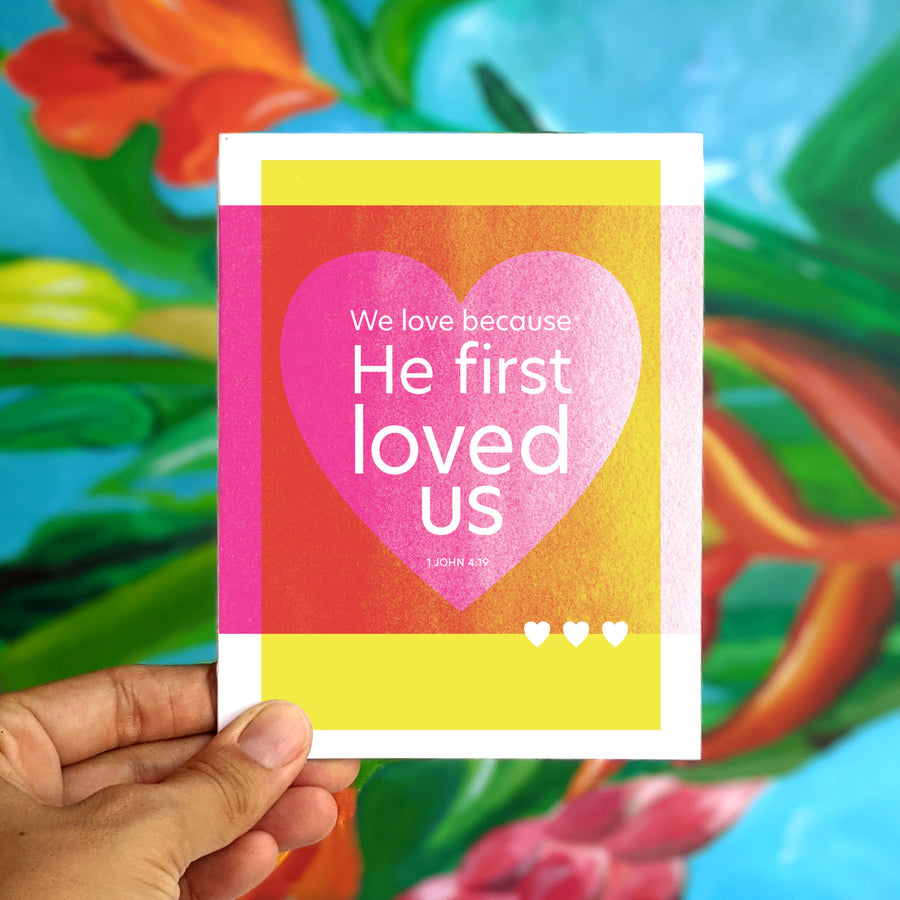Modern Christian greeting card with 1 John 4:19 We love because He first loved us.