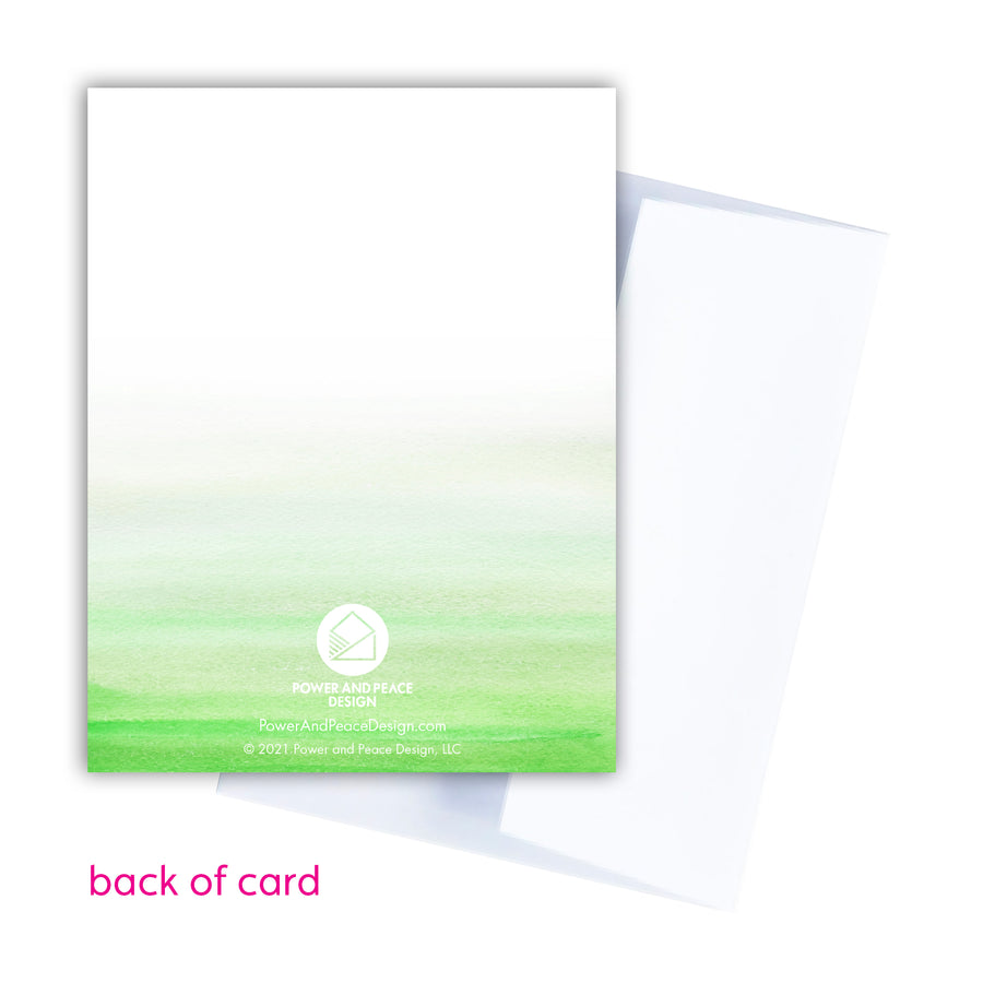 back of green Christian greeting card. Power and Peace Design logo centered in white.