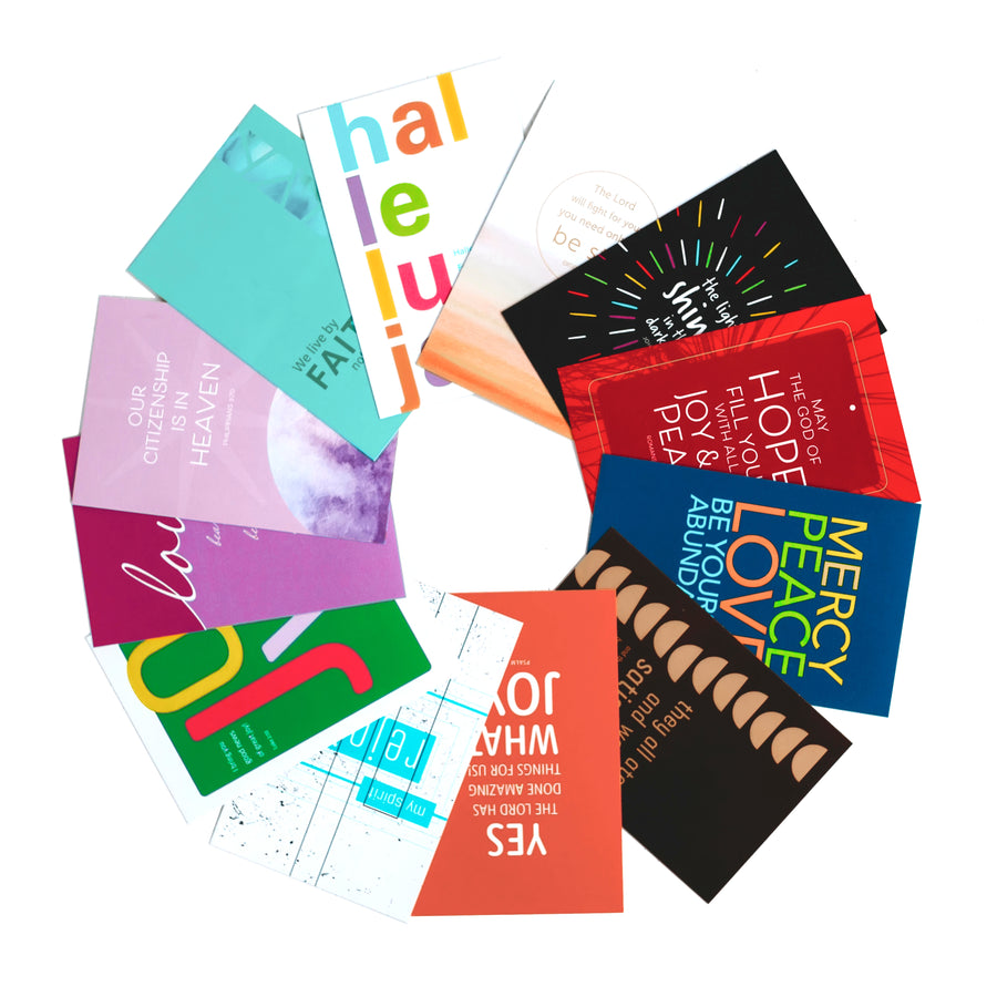 A grouping of a dozen colorful Scripture postcards displayed overlapping in a ring.