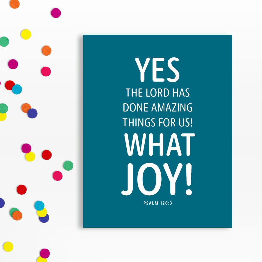 Religious birthday card with Psalm 126:3. Peacock blue background with white text Yes, the Lord has done amazing things for us! What joy! Psalm 126:3. Confetti along left side of image.